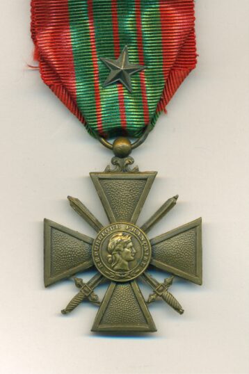 Obverse view of medal. Croix de Guerre, bronze, reverse dated 1939-1940, with star emblem on riband, in card box of issue