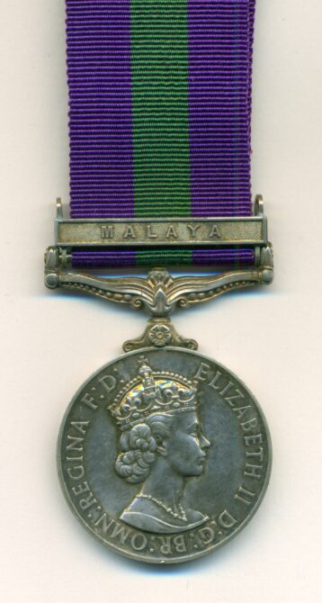 Obverse view of medal. General Service Medal 1918-1962, 5th issue Elizabeth II D:G: BR: OMN:, 1 clasp: Malaya. 23491964 Trooper. A. Parsons. King's Dragoon Guards