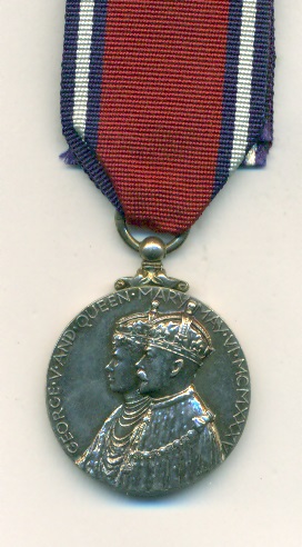 Obverse view of medal. Silver Jubilee Medal 1935, contemporarily engraved ‘W. G. Latham’.