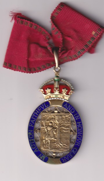 The Order of the Companions of Honour, G.V.I.R. ‘G.R.I.’, breast badge in silver-gilt and enamels, 40mm width, with original segment of neck ribbon, and in original brown-leather and gilt embossed fitted case of issue, very slightly stained to interior, typical light flaking to blue enamel,.  GVF