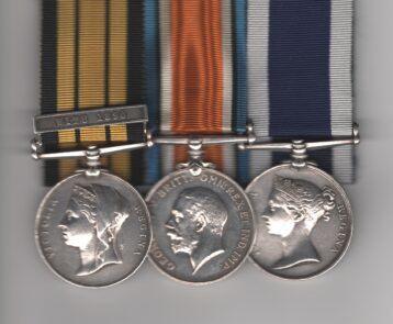 Obverse view of medals. East and West Africa Medal 1887-1900, 1 clasp, Witu 1890 (G. Jones. A.B. H.M.S. Conquest.); British War Medal (111713 G. Jones. C.P.O. R.N.); Royal Navy Long Service and Good Conduct Medal, Victoria British Issue 'Regina', with narrow suspender (Geo. Jones, P.O. 1st. Cl., H.M.S. Victory.). Chief Petty Officer George Jones, Royal Navy. Mounted court-style for display purposes, contact marks to first and last.