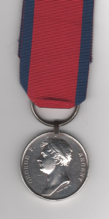 Obverse view of medal. Waterloo Medal 1815, Original suspension clip with contemporary replacement ring. Corporal Richard Green, 1st Regiment Dragoon Guards.