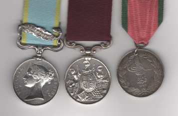 Obverse view of Crimea War Medal 1854-1856, 1 clasp, Sebastopol, unnamed as issued; Army Long Service & Good Conduct Medal, Victoria issue, 3rd type 1874-1901, swivelling scroll suspension with smaller reverse lettering (3773, Serjt. W. O’Neil. 46th. Foot.); Turkish Crimea Medal, Sardinian issue, unnamed as issued, pierced with ring suspension. Sergeant William O’Neil, 46th Regiment of Foot.