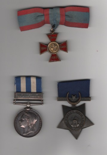 Obverse view of Royal Red Cross, 1st Class V.R. Silver gilt and enamel, lady’s bow; Egypt Medal 1882-1889, undated reverse, 1 clasp, The Nile 1884-85 (Nursing Sister, M. Barker.); Khedive's Star 1882-1891, Dated 1884-6. Unnamed as issued.