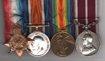 Obverse view of 1914-15 Star (4815 Sjt. T. G. Lawrence, Rif. Brig.); British War Medal (4815 C.Sjt. T. G. Lawrence. Rif. Brig.); Victory Medal (4815 C.Sjt. T. G. Lawrence. Rif. Brig.); Army Meritorious Service Medal, George V issue military bust (24287 C.Q.M. Sjt. T. G. Lawrence. 19/Garr: Bn. Hamps: R.). Company Quartermaster Sergeant T. G. Lawrence, Rifle Brigade, later Hampshire Regiment. Light contact marks.