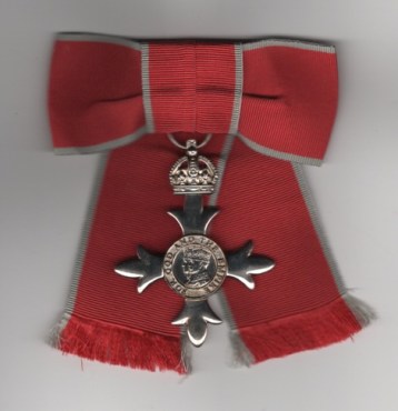 Obverse view of Most Excellent Order of the British Empire, Members M.B.E. 2nd type (civil) ladies issue on a bow.