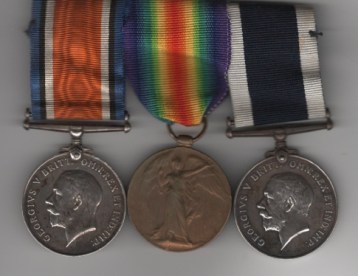Obverse view of British War Medal (K.53409 W. L. Jones. Sto. 2 R.N.); Victory Medal (K.53409 W. L. Jones. Sto. 2 R.N.); Royal Navy Long Service and Good Conduct Medal, George V, 2nd type coinage head, 1930-1936 (M.53109 W. L. Jones. Sto.1 H.M.S. Falmouth.). Stoker First Class W. L. Jones, Royal Navy. Contact marks.