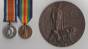 Obverse view of British War Medal (L-40880 Gnr. B. J. Faux. R.A.); Victory Medal (L-40880 Gnr. B. J. Faux. R.A.); Memorial Plaque (Benjamin Joseph Faux). L-40880 Gunner B. J. Faux, Royal Artillery.