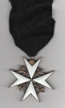 Obverse view of Order of St. John of Jerusalem, Officer (brother) breast badge enamelled cross in silver-gilt. In case of issue. Minor signs of wear to reverse.