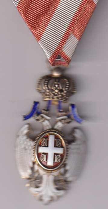 Serbia, Kingdom, Order of the White Eagle, 2nd type, Civil Division, Fifth Class breast badge, 69mm including crown suspension x 34mm, silver, silver-gilt and enamel. Slight flaking to reverse red center enamel.