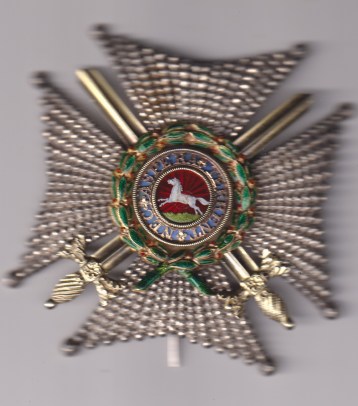 Royal Guelphic Order, K.C.H. (Military) Knight Commander’s breast star, 82mm, silver, gold appliqué, and enamel, with applied swords in silver-gilt, the wreath fitted with stalks unmarked, with silver retaining pin. Minor enamel damage to central medallion GVF