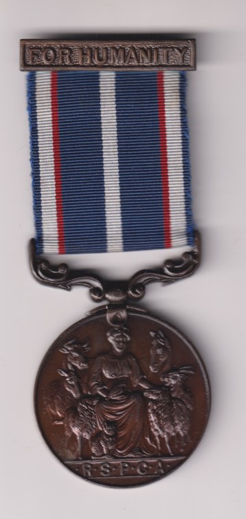 Royal Society for the Prevention of Cruelty to Animals, in bronze, with 'For Humanity' clasp . Engraved Police Constable M.D. Williams 1967.  EF