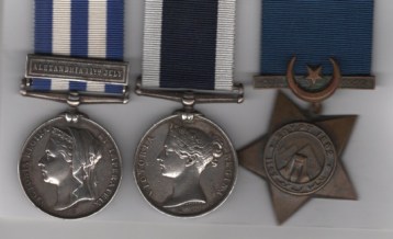 Egypt Medal 1882-1889, (Dated 1882)  1 clasp, Alexandria 11th July (W. Allen. Sh: Cpl. 1. Bl. H.M.S. “Alexandria”.); Royal Navy Long Service and Good Conduct Medal, Victoria narrow suspender, with impressed naming type, 1878-1901 (William Allen, Mr. at Arms. H.M.S. Orion.); Khedive’s Star 1882. Master at Arms W. Allen, Royal Navy . H.M.S. Orion VF.