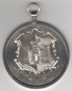 Exeter Volunteers 1802. A silver engraved medal, raised rim, 60mm, the obverse depicting the City of Exeter coat of arms including the motto ‘Semper Fidelis’, the reverse engraved ‘Awarded to Sergt. H. Lewis by the Officers of the Exeter Volunteers for Merit. 18th Oct. 1802’. NEF