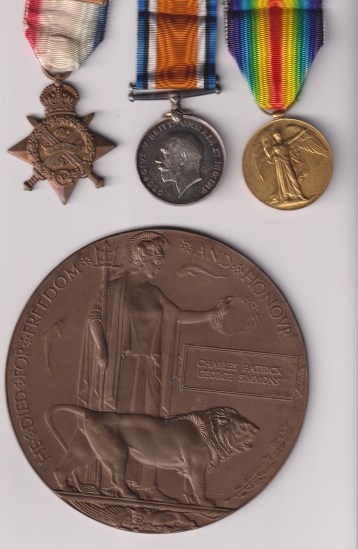 1914 Star, with original Mons clasp,(8762 Pte. C.P.G. Simmons 1/Hamps.R.) British War Medal, Victory Medal ( 8762 Sgt. C.P.G. Simmons Hamps.R.) Memorial Plaque (Charles Patrick George Simmons) 8762 Sergeant C.P.G. Simmons EF