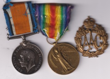 British War Medal, Victory Medal (1477  Wrk E. Hogarth  O.M.A.A.C.), Badge. 1477  Worker E. Hogarth  Queen Mary's Army Auxiliary Corps.  GVF