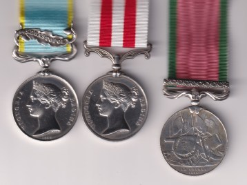 Crimea War Medal 1854-1856, 1 clasp, Sebastopol, Indian Mutiny Medal 1857-1858, no clasp, (Mark Perry 1st Bn. 13th Lt. Infy) Turkish Crimea Medal, Sardinian issue, with Crimea type suspender and ornate ribbon bar. VF/GVF